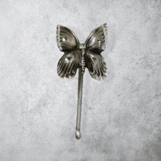 Hand casted pewter pony tail cover with a diamond cut finish. Butterfly design.