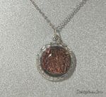Amber Glass Pendant in Decorative Stainless Steel Setting