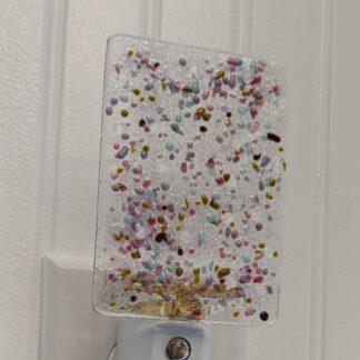 LED Autosensing Night Light with Multicolored specks of glass on clear glass